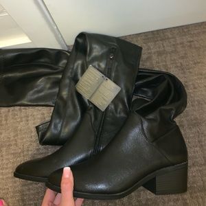 Thigh high black leather boots